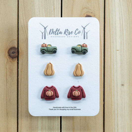 Fall clay stud pack. Inlcudes green truck with a pumpkin, ghourd or butternut squash, red sweater with a pumpkin on it.